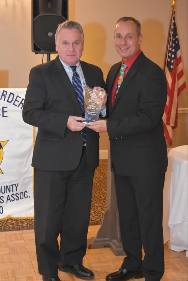 Congressman Smith receiving the Legislator of the Year award from Lodge President Reece