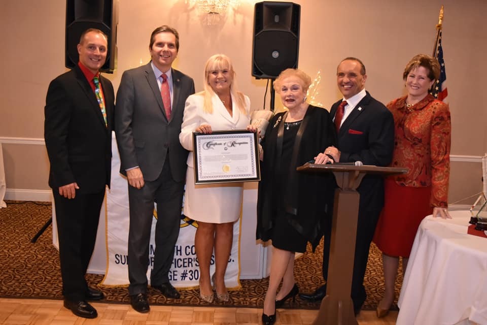 Lodge President Reece, Freeholder Scharfenberger, Person of the Year Teri O'Connor, Freeholder Burry, Director Arnone, and Freeholder Kiley